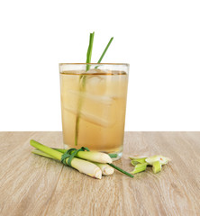 Cold lemongrass tea on a wooden table, free space