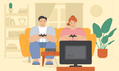 A man and a woman playing video games on a couch at home during Covid-19 quarantine - 347084347
