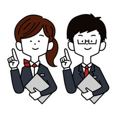 ノートPC片手に指差しする接客業の男女