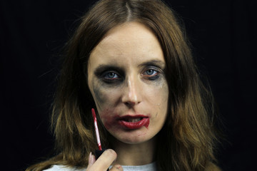 Obraz premium Crazy drunk girl with smeared mascara and lipstick