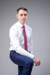 man in a business suit on a plain background