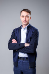 man in a business suit on a plain background