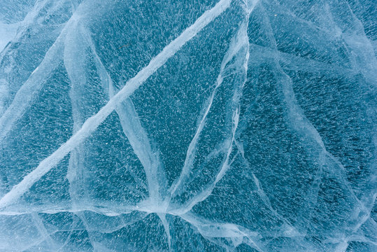 Beautiful ice of Lake Baikal with abstract cracks