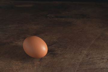 chicken eggs on wooden table background, eggs with copy space concept.
