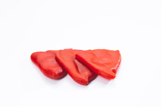 Roasted piquillo peppers isolated on  white background.