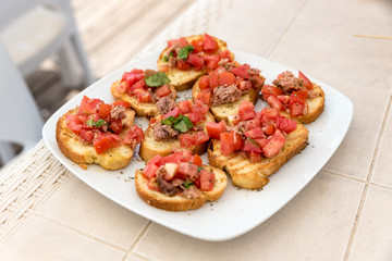 Appetizer of bruschetta with tuna