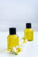 Essential oil with chamomile flower extract. Hygiene bath product. Wellness therapy regeneration