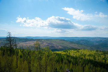 Fototapeta na wymiar Mountain landscape.Magnificent panoramic view of the forest and beautiful blue sky. The beauty of wild virgin nature. peace