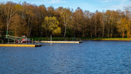 Fototapeta na wymiar Boat landing on the lake in the Park at sunset.