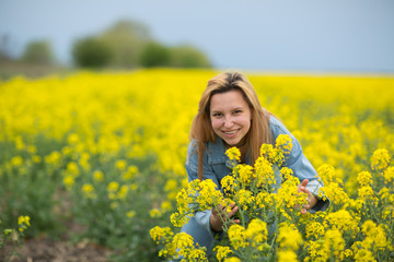 beautiful young woman on flower field