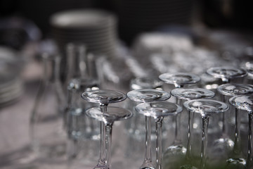 inverted glasses stand on the table, the glass shines