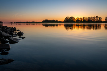 In the evenings with a beautiful sunset at the river 