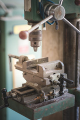 The retro drilling machine in the workshop.