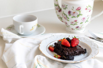 cake with berries, cup of tea 