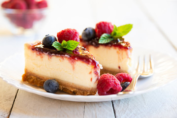 Homemade delicious cheesecake with fresh fruit and mint