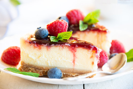 Homemade delicious cheesecake with fresh fruit and mint