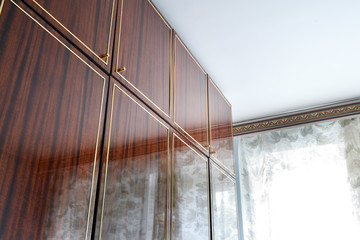 Old soviet vintage brown wardrobe.Old apartment design.