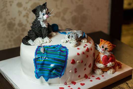 beautiful festive cake with figures of cats