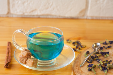 Crystal cup with green tea on table