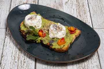 Toast with avocado and egg.