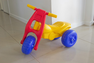 Naklejka premium Bright colored plastic toy bike
