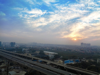 Fototapeta na wymiar City scape india with sunny dramatic sky background