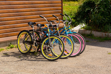 Fototapeta na wymiar bicycles stand in a public point, bike rental service