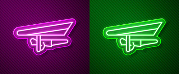 Glowing neon line Hang glider icon isolated on purple and green background. Extreme sport.  Vector Illustration