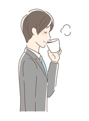 マグカップのコーヒーを飲む男性の横顔