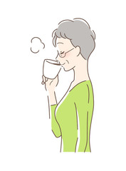 マグカップのコーヒーを飲む女性の横顔