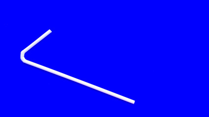 One curved white plastic tube for juices and cocktails on a blue background. Disposable straws. The subject of serving. Bar accessories. Summer planet pollution concept.