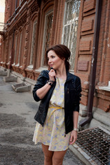 Portrait of a beautiful brunette with a smile. Close up. Warm tone