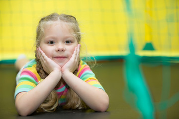 Preschooler smiles.Preschooler in the gym