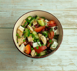 Salad with chicken, vegetables and brine cheese