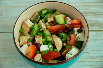 Salad with chicken, vegetables and brine cheese