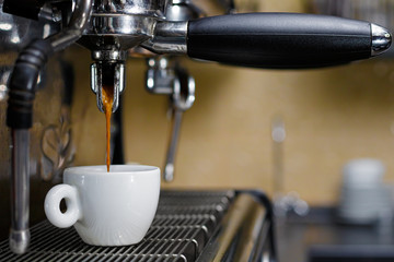 Professional coffee machine making espresso in a cafe or restaurant