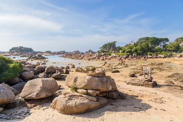 Perros-Guirec, France. Beach on the shore of Pink Granite. Right: Oratoire de Saint-Guirec, 14th century