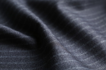 Texture of dark striped fabric as background, closeup