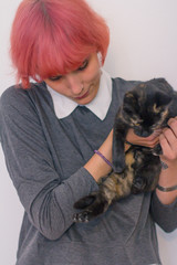 Girl with pink hair and cat