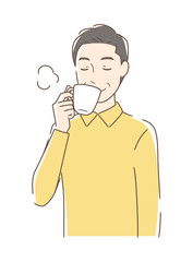 マグカップのコーヒーを飲む男性