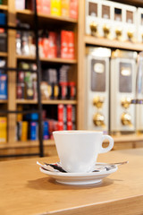 Coffee close up in a wooden table. Coffee shop background with copy space