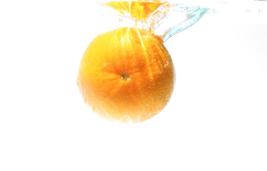 Orange fruit in water