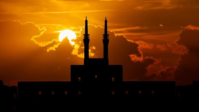 Mosque Amir Chakhmaq: Time Lapse at Sunset with Red Clouds and Fiery Sun, Yazd, Iran