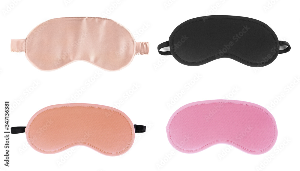 Wall mural Set of different sleeping eye masks on white background, top view. Bedtime