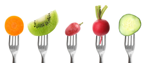 Forks with different vegetables and fruits on white background, banner design. Healthy meal