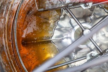 The process of extracting honey from bee honeycombs