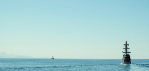 Fototapeta na wymiar Ancient ship sailing to the shore