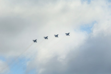 A group of warplanes flying at the blue sky