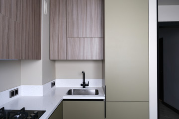 Kitchen interior design in brown and khaki colors