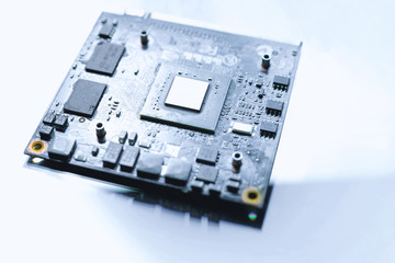 Selective focus of close up the computer electronic circuit board , extremely shallow DOF. Microprocessor on pc motherboard on white background. Computer hardware technology. Shoot in high key